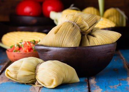 Humitas: Cornmeal dough filled with meat and red pepper baked in plantain leaves